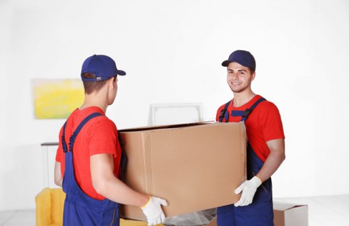 Professional removals van and moving crew in South Wimbledon street