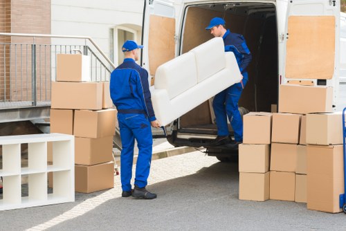 Furniture and boxes being carried for a South Wimbledon move