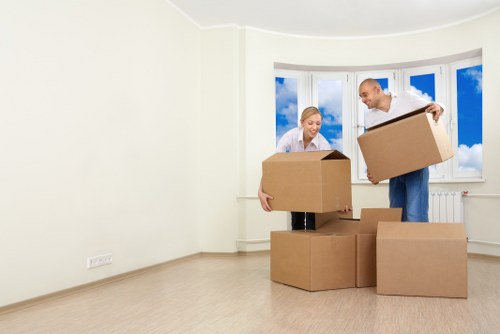 Local movers handling boxes near South Wimbledon flats