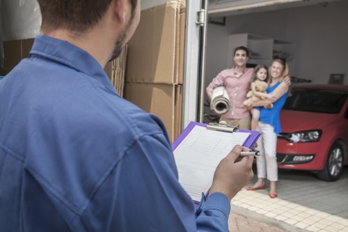 Driver and helper handling items during a van and man move