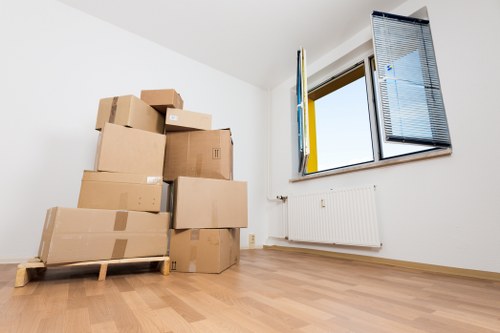 Professional movers handling household items in a South Wimbledon flat