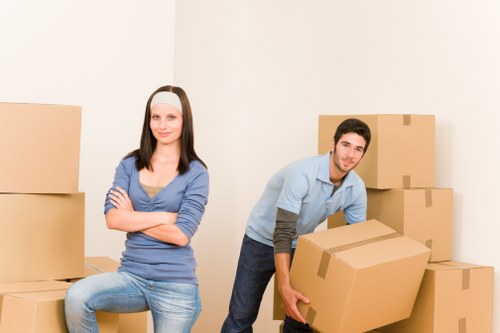 Professional movers loading boxes for a local move