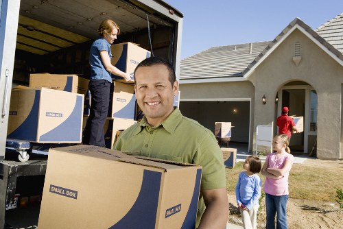 Packed moving boxes and furniture ready for transport in South Wimbledon